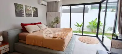 Modern bedroom with large windows and garden view, featuring stylish decor and cozy ambiance.