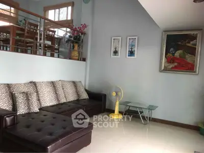 Spacious living room with modern decor and stylish furniture, perfect for relaxation and entertaining guests.
