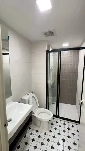 Modern bathroom with sleek design and glass shower enclosure