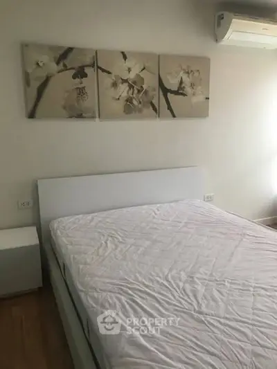 Modern bedroom with elegant decor and air conditioning unit