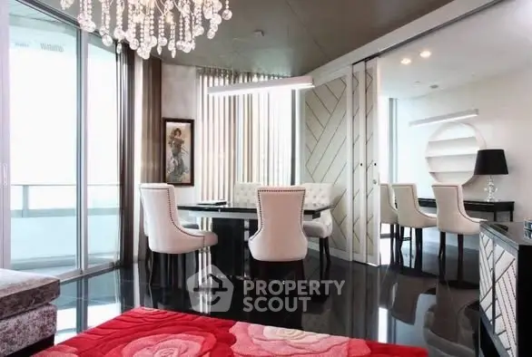 Luxurious dining area with elegant chandelier and modern decor