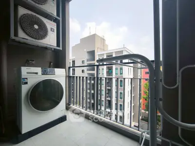 Modern balcony with washing machine and city view, perfect for urban living.