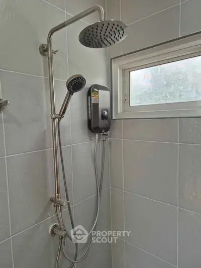 Modern bathroom shower with dual showerheads and water heater