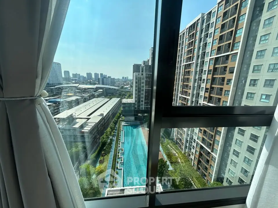Stunning high-rise apartment view with pool and cityscape, perfect for urban living.