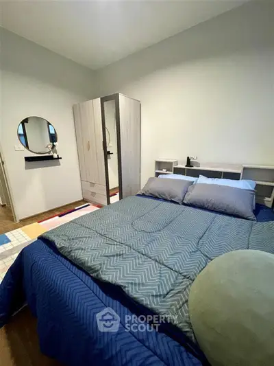 Cozy bedroom with modern decor and ample storage space