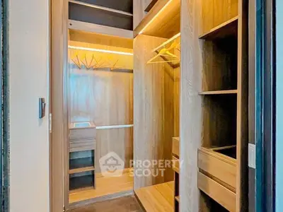 Spacious walk-in closet with wooden shelves and ample hanging space