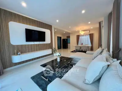 Spacious modern living room with elegant decor and open dining area