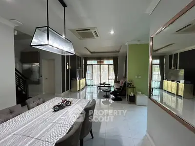 Spacious modern living room with elegant dining area and stylish decor