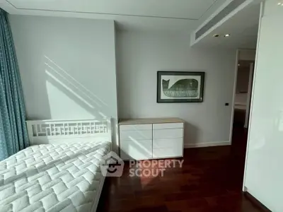 Modern bedroom with stylish decor and natural light