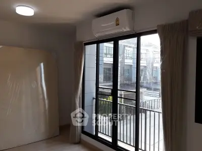 Modern apartment bedroom with balcony and natural light