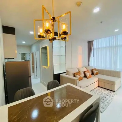 Modern living room with elegant lighting and cozy seating area