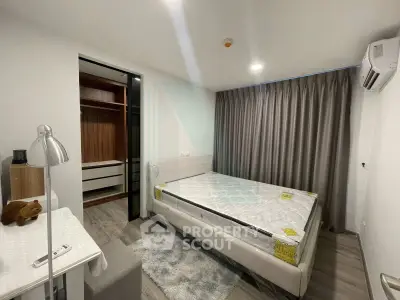 Modern bedroom with walk-in closet and air conditioning in a stylish apartment.