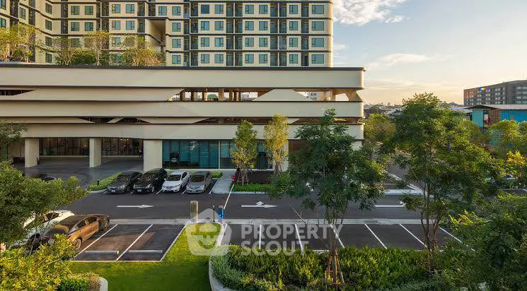 Modern residential building with lush greenery and spacious parking area