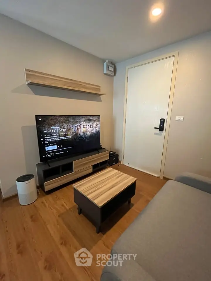 Modern living room with sleek TV setup and stylish wooden furniture