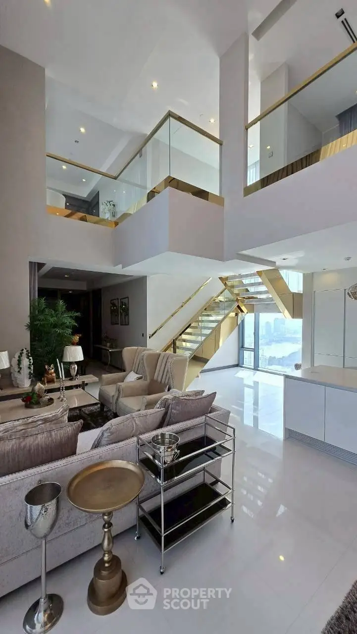 Luxurious modern living room with high ceilings and elegant staircase