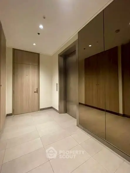 Modern building elevator lobby with sleek design and warm lighting