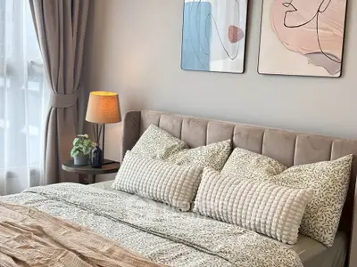 Elegant bedroom with stylish decor and cozy bedding