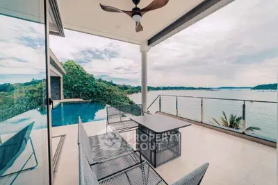 Stunning balcony with breathtaking ocean views and modern outdoor furniture