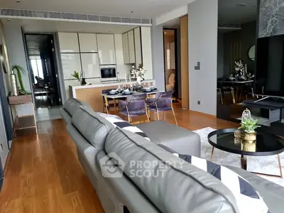 Luxurious modern living room with open kitchen and elegant dining area