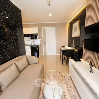 Modern living room with elegant decor and open kitchen layout