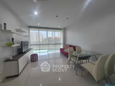 Spacious modern living room with sleek furniture and large windows