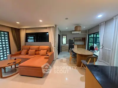 Spacious modern living room with open kitchen and stylish furniture