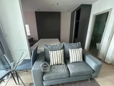 Modern studio apartment with cozy living area and stylish decor