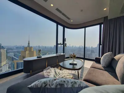 Luxurious corner unit living room with panoramic city views and elegant decor.