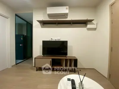 Modern living room with air conditioning and sleek TV setup