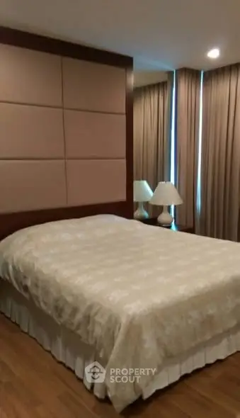 Elegant bedroom with cozy lighting and stylish decor, perfect for relaxation and comfort.