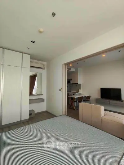 Modern open-plan living room with cozy seating and stylish decor