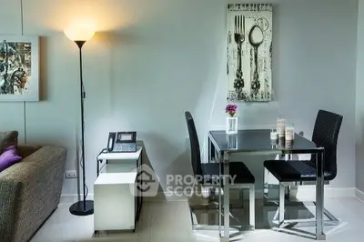 Modern dining area with sleek furniture and stylish decor in a cozy living space.
