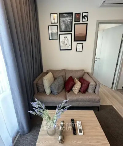 Cozy living room with stylish decor and comfortable sofa, perfect for relaxation.