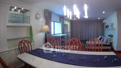 Spacious dining and living area with elegant decor and ample natural light.