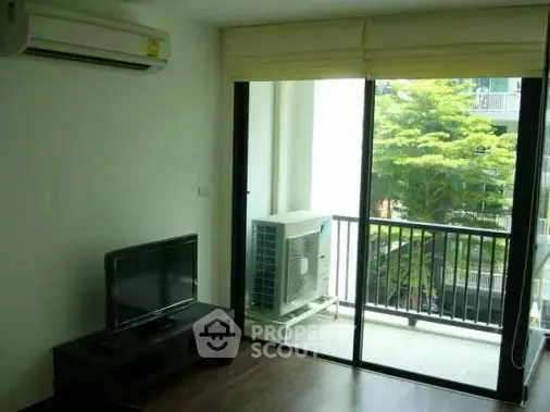 Modern living room with balcony view and air conditioning in a stylish apartment.