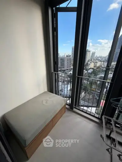 Modern balcony with stunning city view and cozy seating area