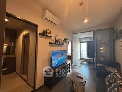 Modern living room with sleek design and open layout, featuring a cozy ambiance.