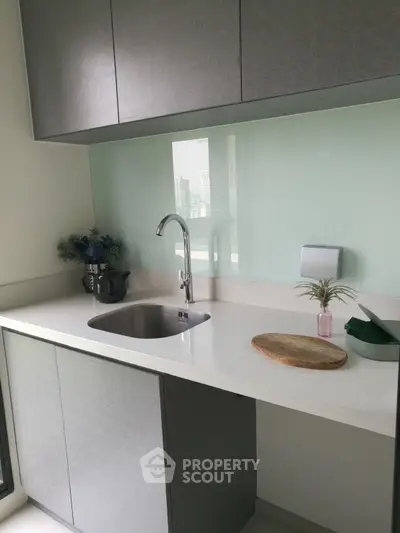 Modern kitchen with sleek cabinetry and stylish backsplash