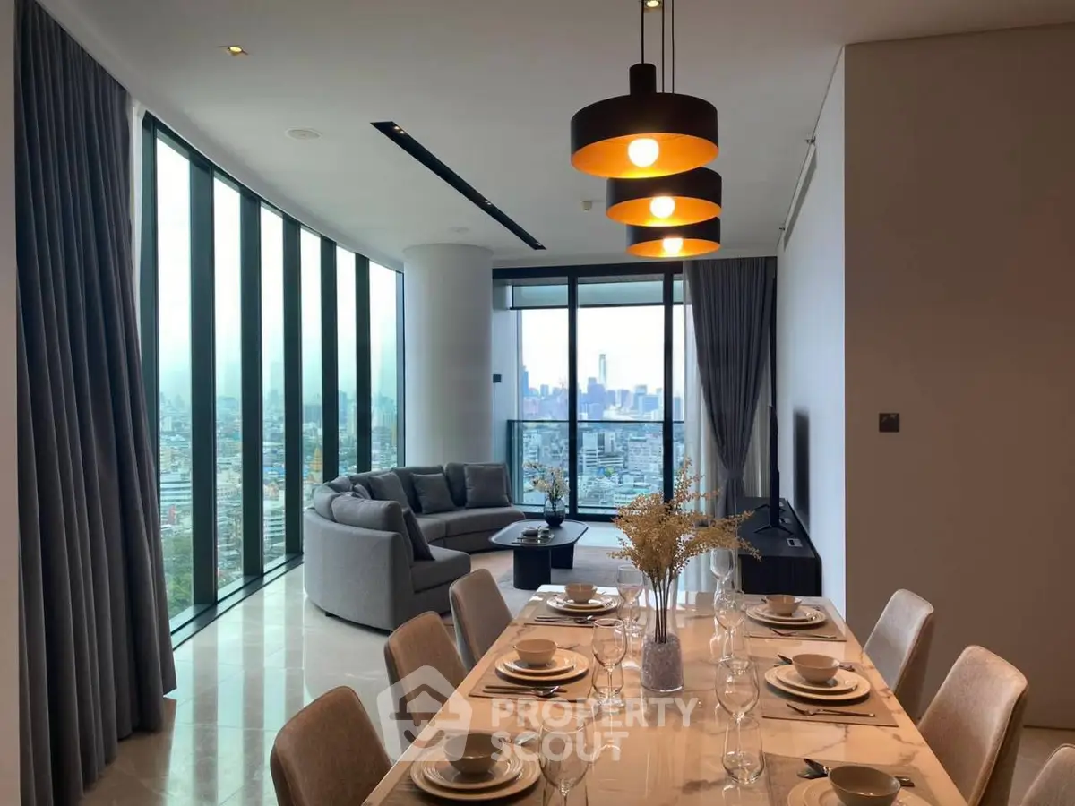 Luxurious open-plan living room with stunning city view and elegant dining area.