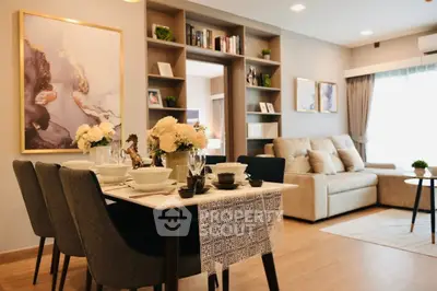 Elegant living room with dining area, modern decor, and cozy seating in a stylish apartment.