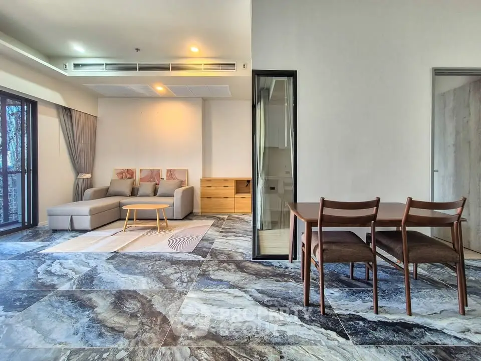 Spacious modern living room with elegant marble flooring and stylish furniture