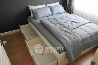 Modern bedroom with storage bed and elegant decor, perfect for maximizing space and comfort.