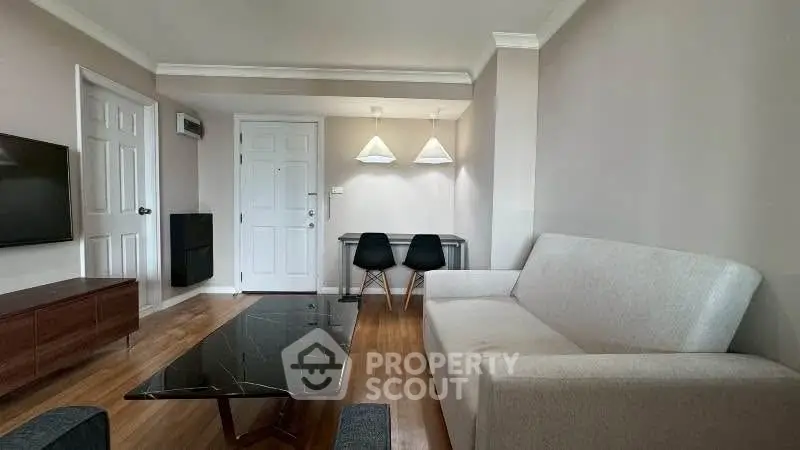 Modern living room with sleek furniture and stylish lighting