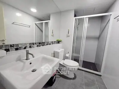Modern bathroom with sleek design and spacious shower area