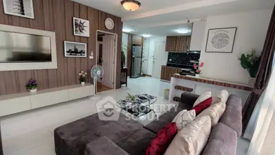 Modern living room with stylish decor and open kitchen layout