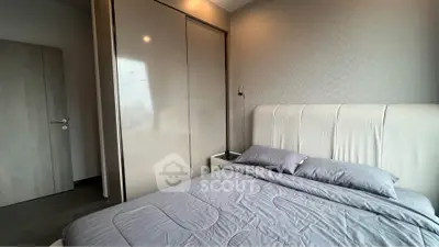 Modern bedroom with sleek wardrobe and stylish decor