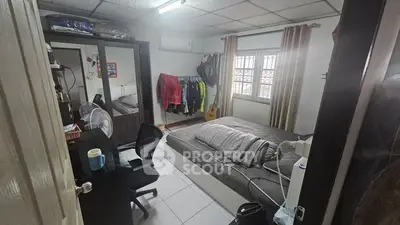 Cozy bedroom with modern furnishings and natural light