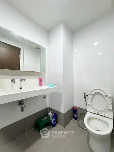 Modern bathroom with sleek fixtures and ample storage space