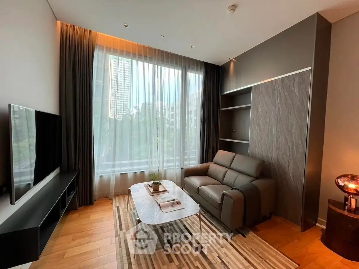 Modern living room with large window and stylish furniture in urban apartment.
