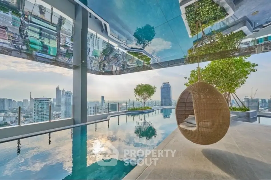Luxurious rooftop infinity pool with panoramic city skyline view, modern wicker lounge chair, and tranquil waters reflecting the sky, perfect for high-end urban living.